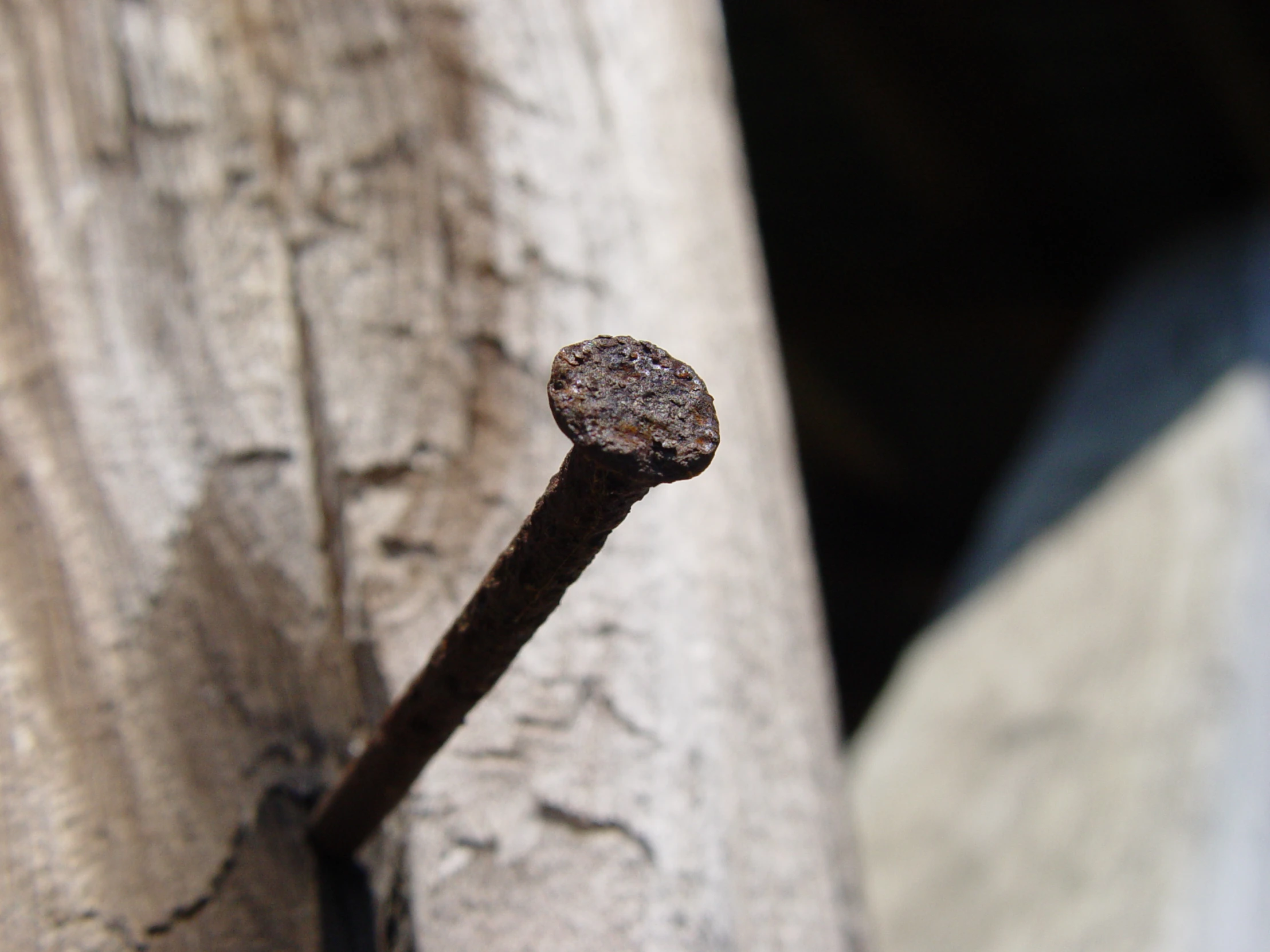 a metal rod sitting on top of a wooden structure