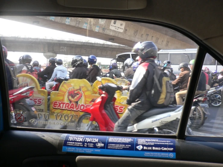 a group of motorcycles that are in the street