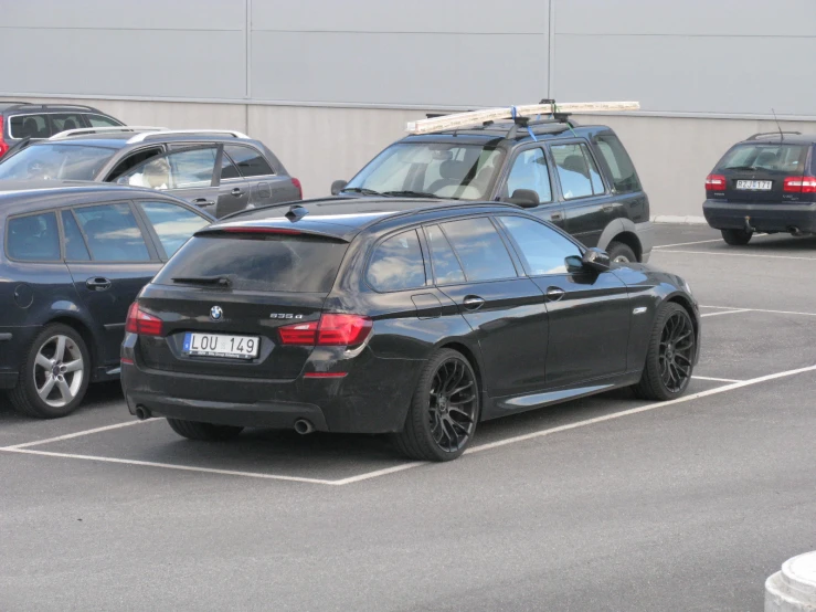 a parked bmw car in an empty parking lot