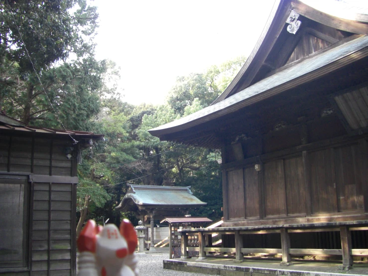 a pagoda sits in the foreground of a house