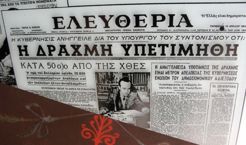 a newspaper with russian texts next to it