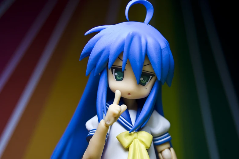 a close up of a toy with blue hair