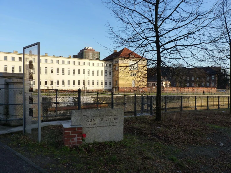 a sign and brick blocks are by the side of the street