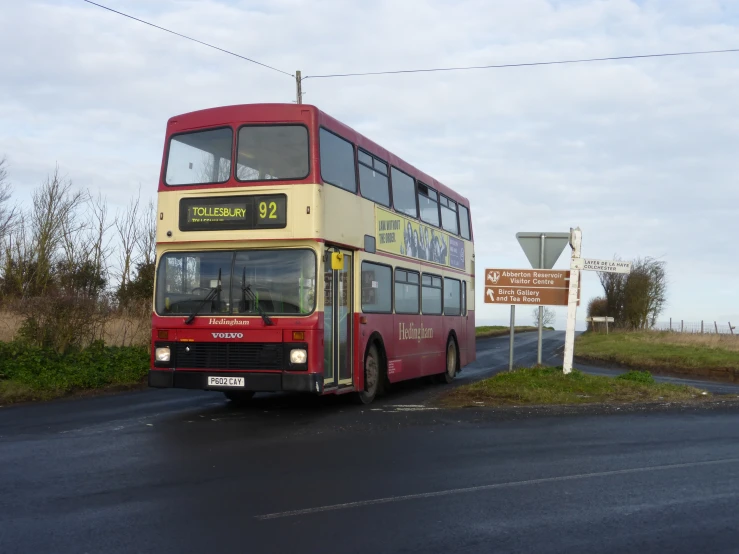 a double decker bus parked by the side of the road