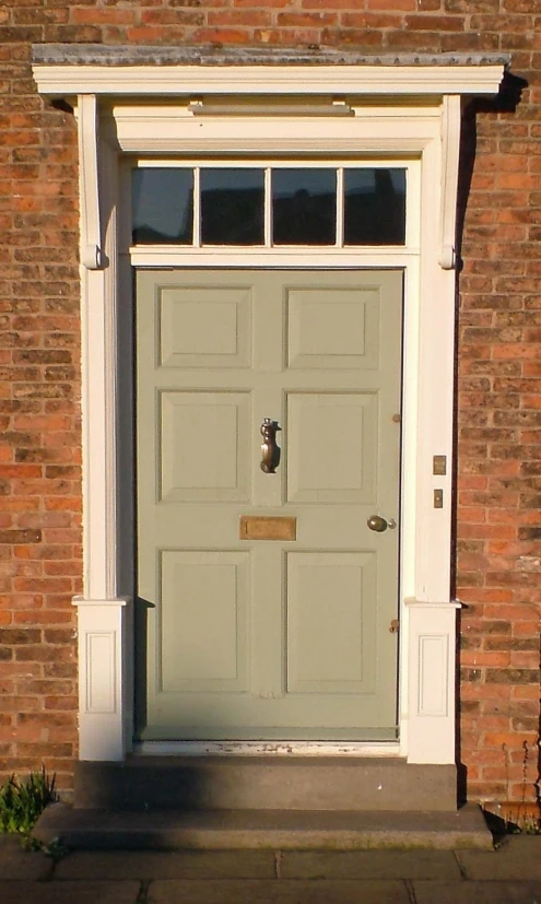 the front door is made of brown bricks