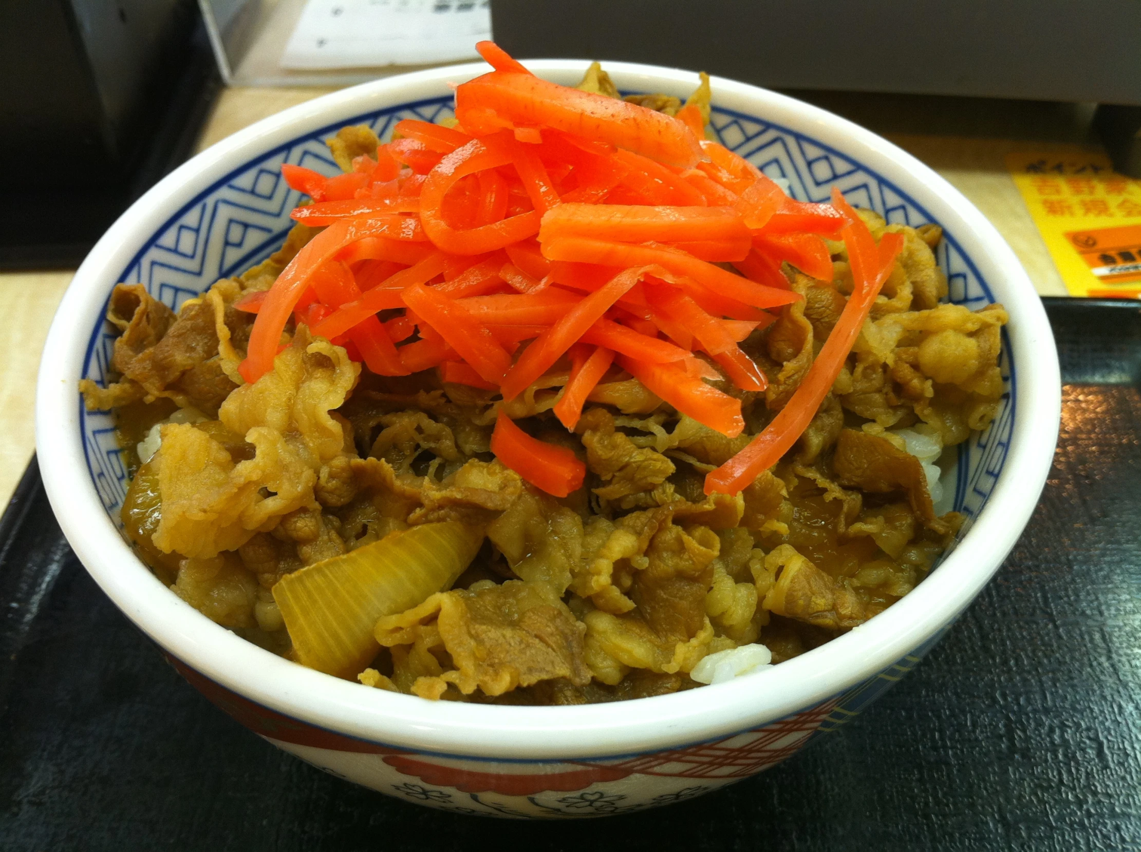 carrots, noodles and other items in a bowl on the table