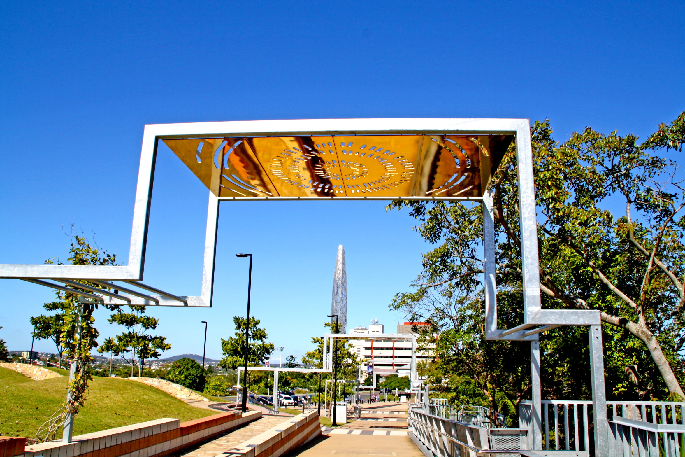 there is a bench sitting under the sign in the park