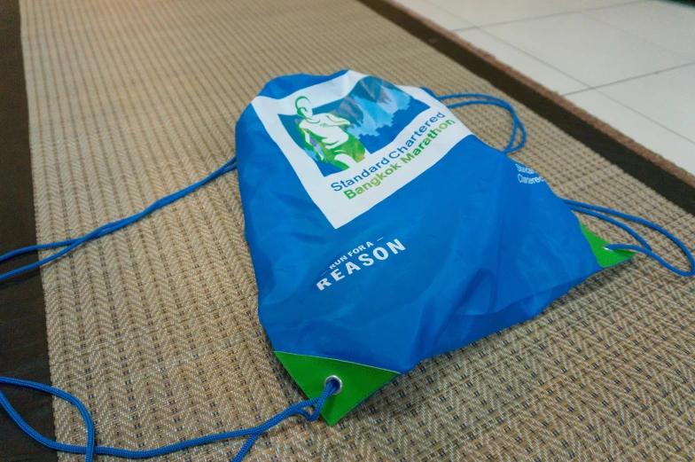 a blue bag sitting on top of the floor