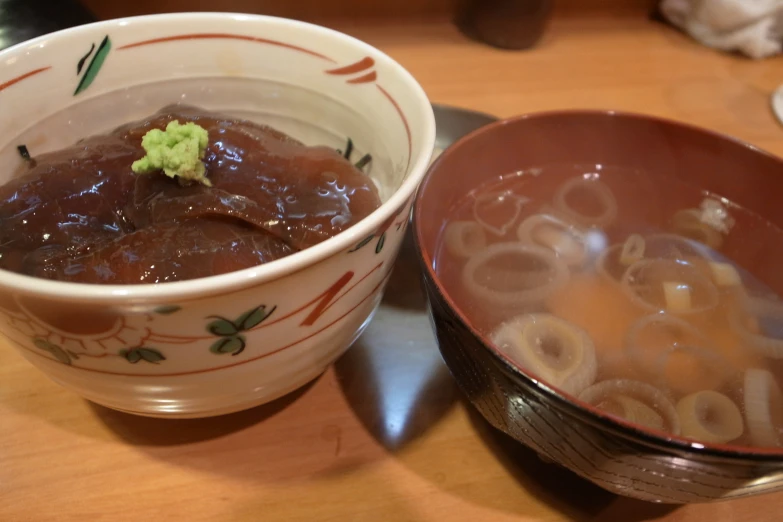 a close up of a bowl of food with noodle