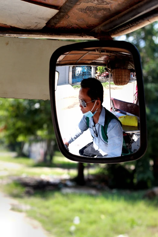 a man riding on a skateboard next to a mirror