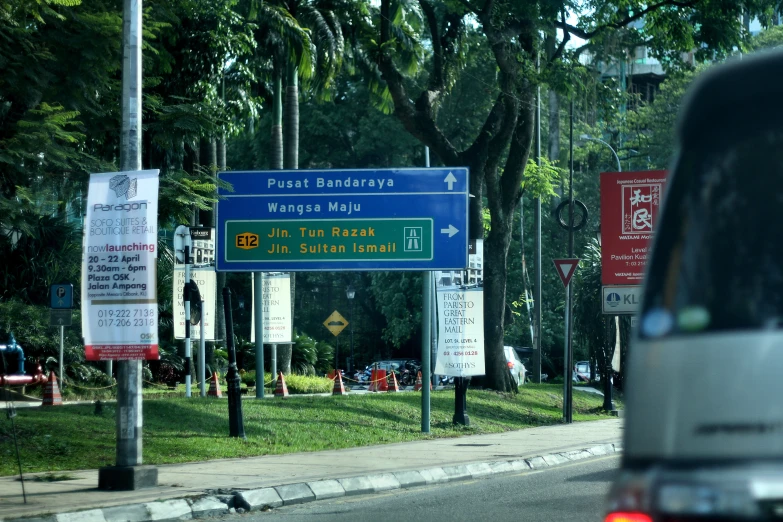 a street sign with directions on it in a foreign country