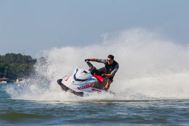 a man on a jet ski riding in the water