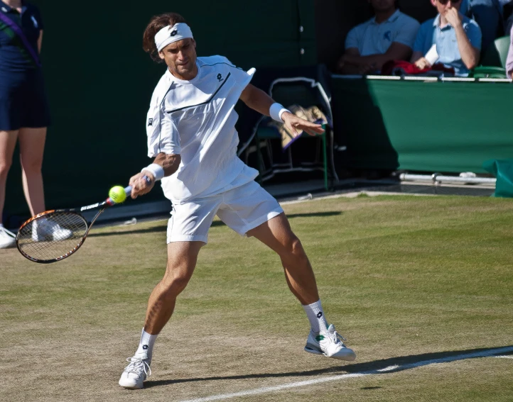 the man is playing tennis on the tennis court