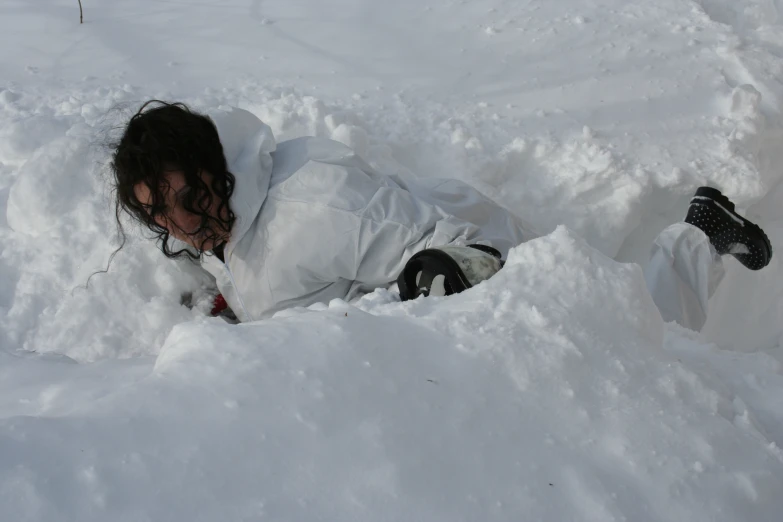 a person is buried in some deep snow