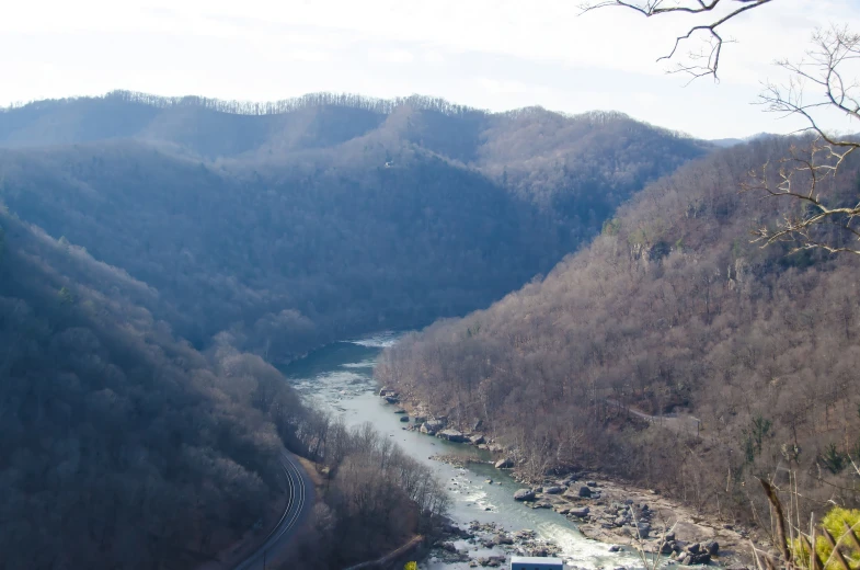 a winding river meanders through a hilly area