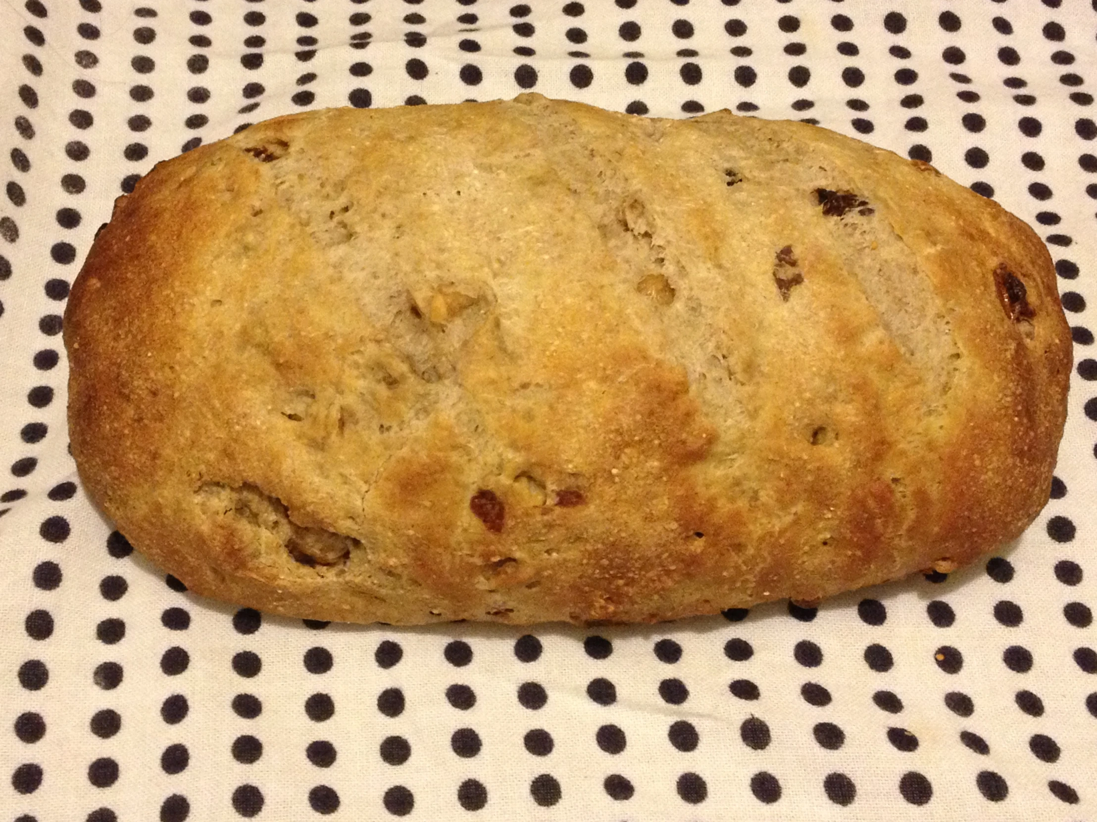 a piece of bread on a black and white table cloth