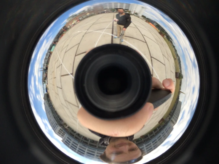 a panoramic view of an object as seen from a pographer's feet