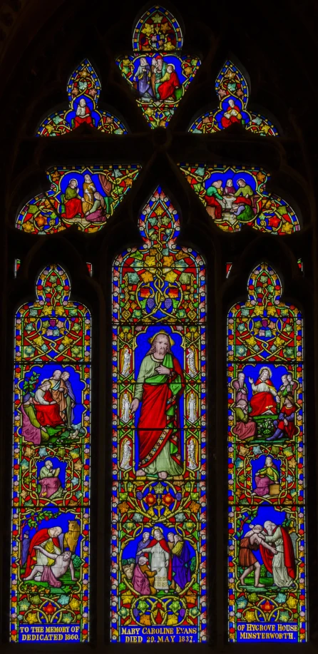 a stained glass window with a figure on it