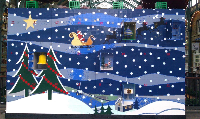 a giant christmas card display in a mall