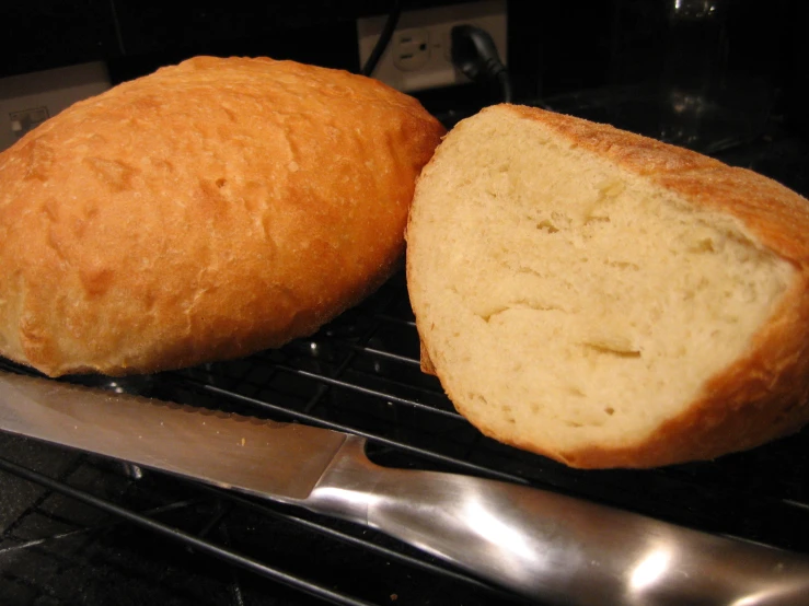 a loaf of bread sitting on top of an oven