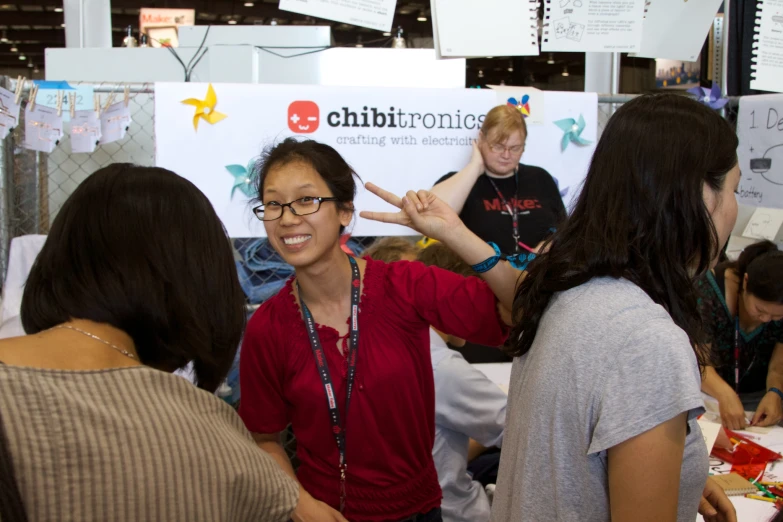 several people at a science fair getting their fingerprints