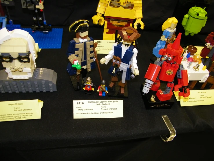 many different legos on display at a convention