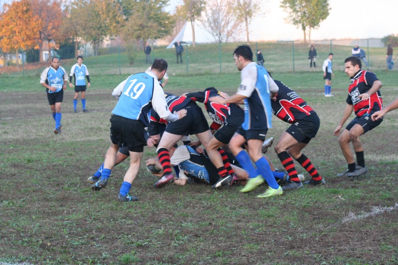 a group of men in soccer uniforms playing a game