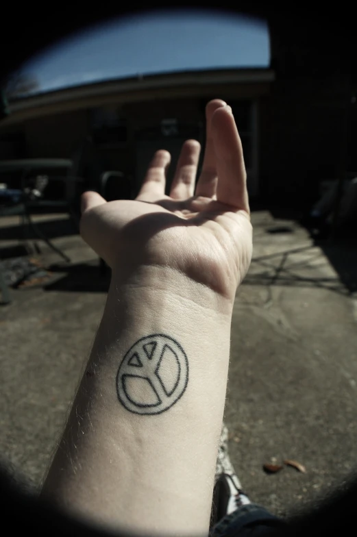 a person with a small tattoo on their wrist