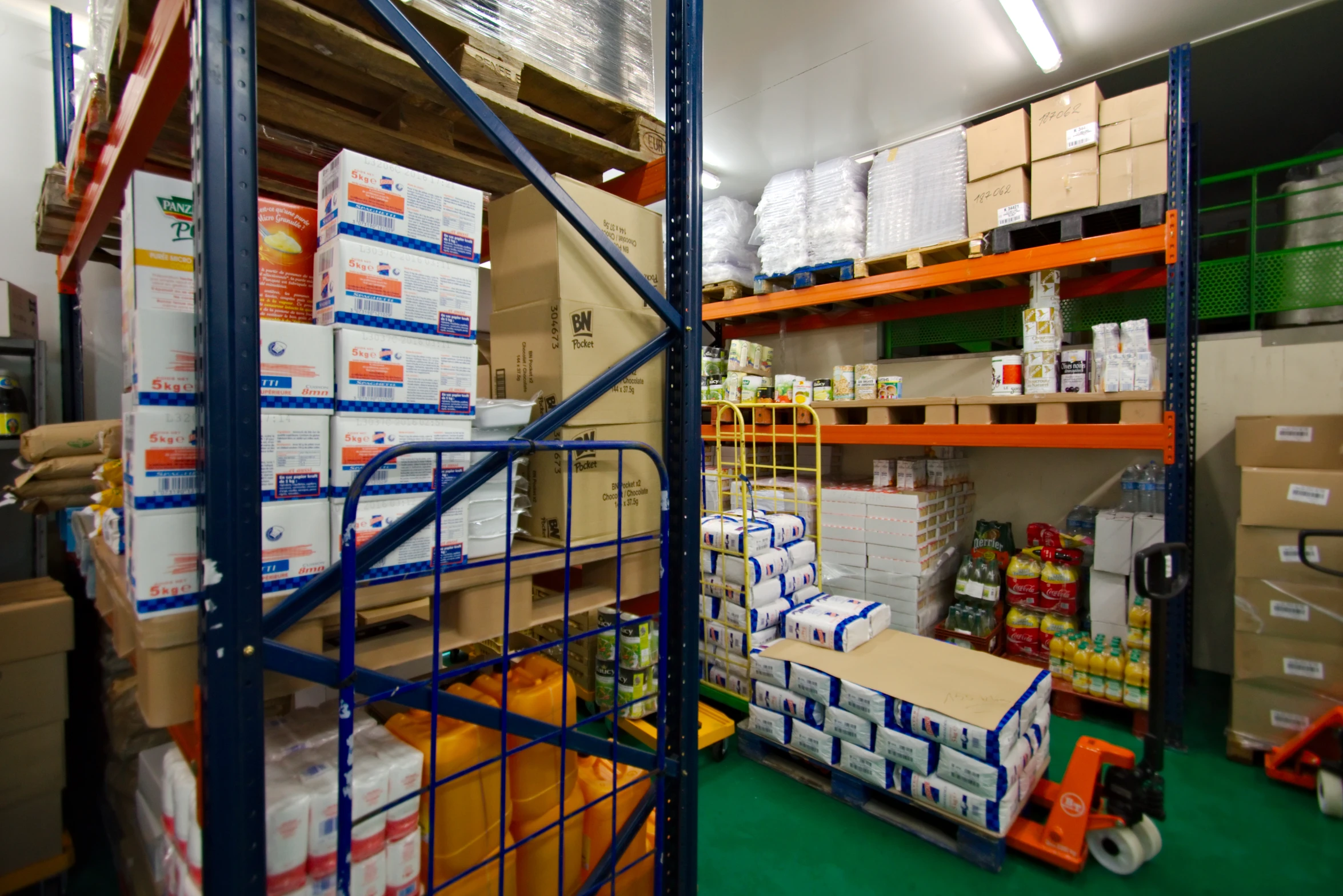 shelves in a warehouse filled with boxes and other supplies