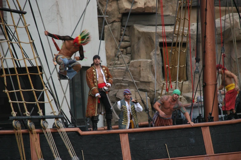 a group of men that are standing on a ship