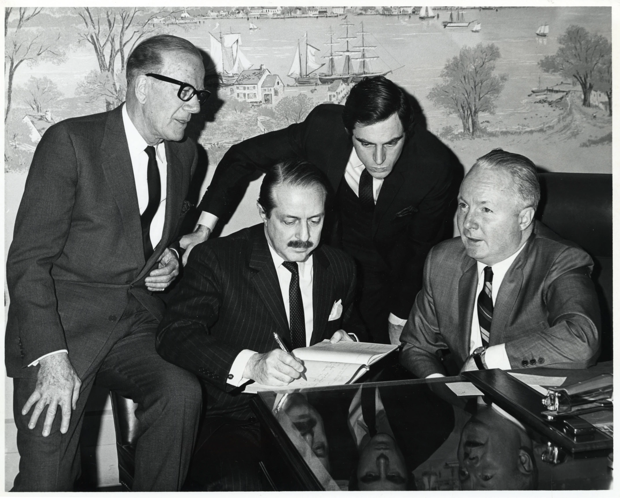 vintage black and white po of business men writing