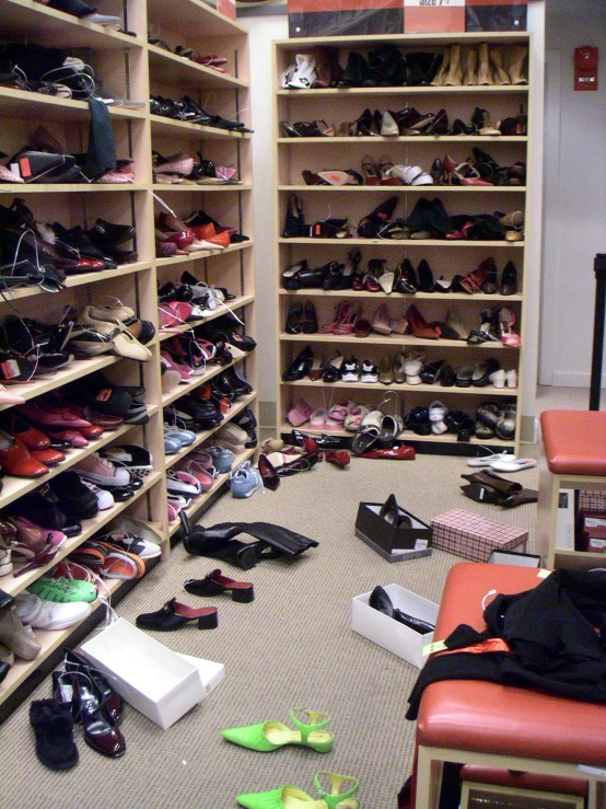 a bunch of shoes sitting on a floor in a room