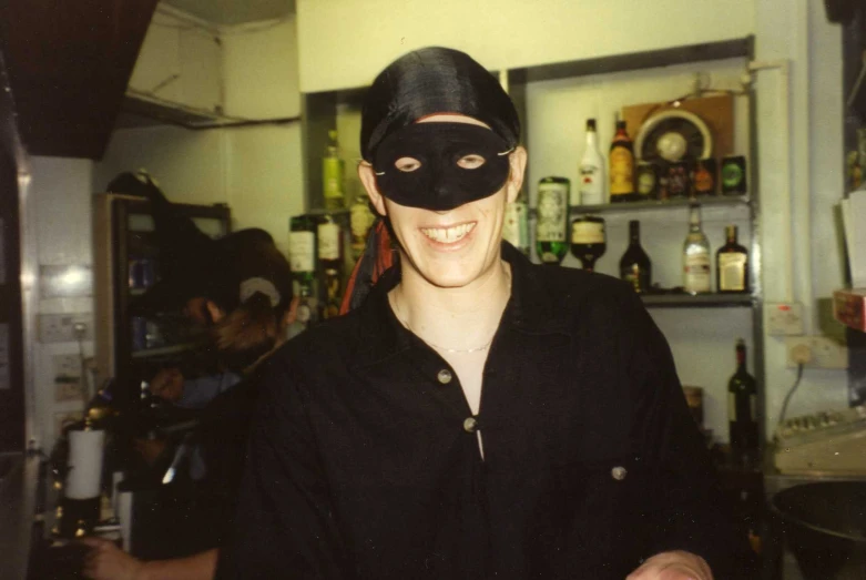 a person with a mask in the kitchen