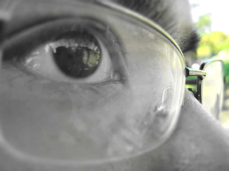 the eye of an eye wearing a pair of glasses