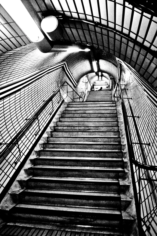 a set of stairs with a skylight above