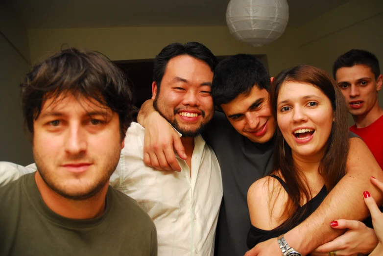 a group of men and women posing for a picture