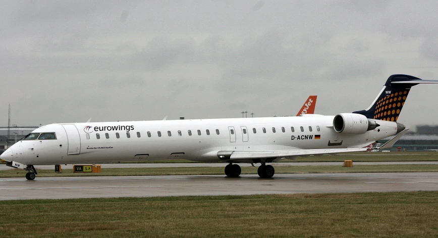 an airplane is being worked on the tarmac by its engine