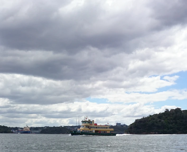 ferry going on the water during cloudy day