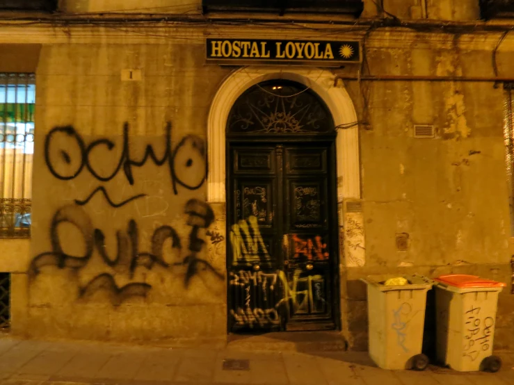 a black and yellow sign above a door