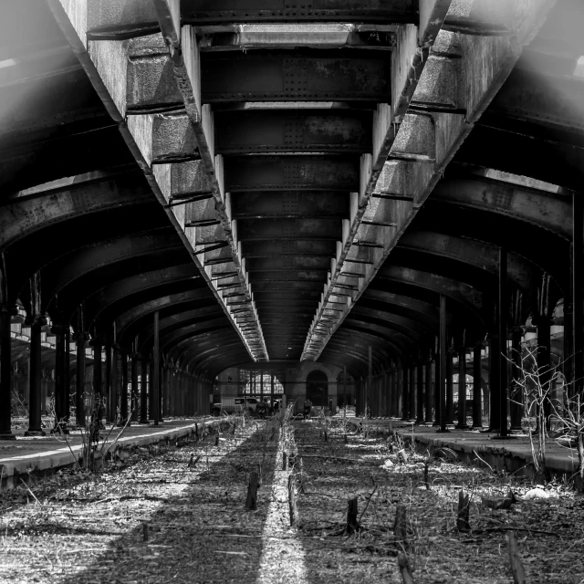 the inside of a bridge with multiple tracks