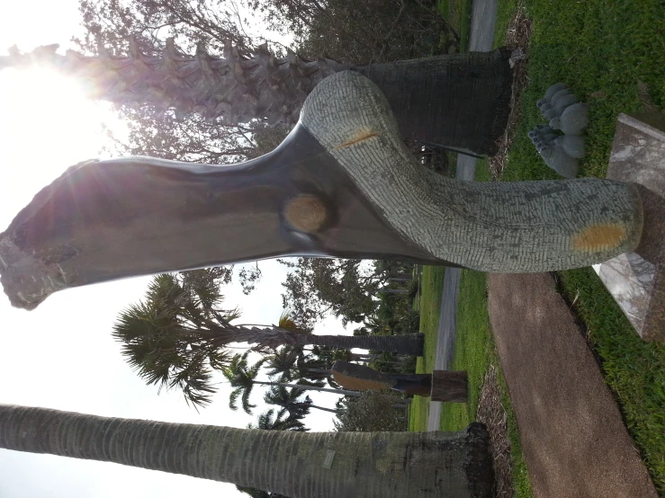 a large statue is sitting in the grass