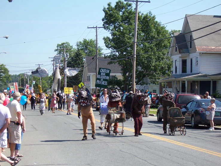 a group of people riding horses on the street in a parade