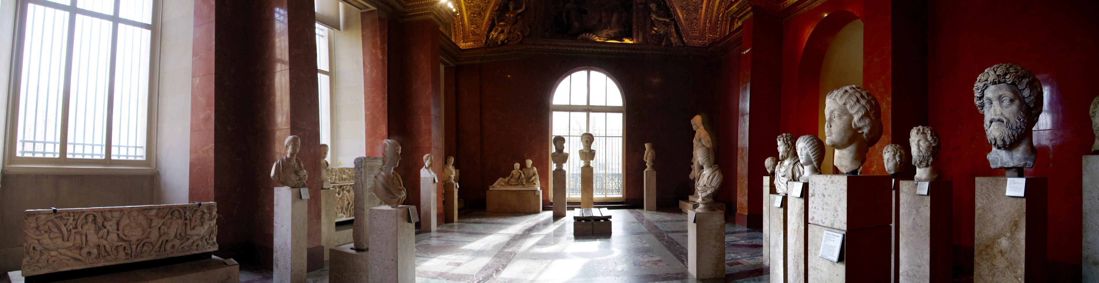 statues lined up in a room in a building