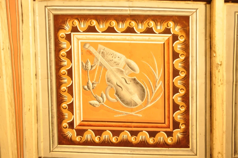 a decorative picture hanging on the side of a building