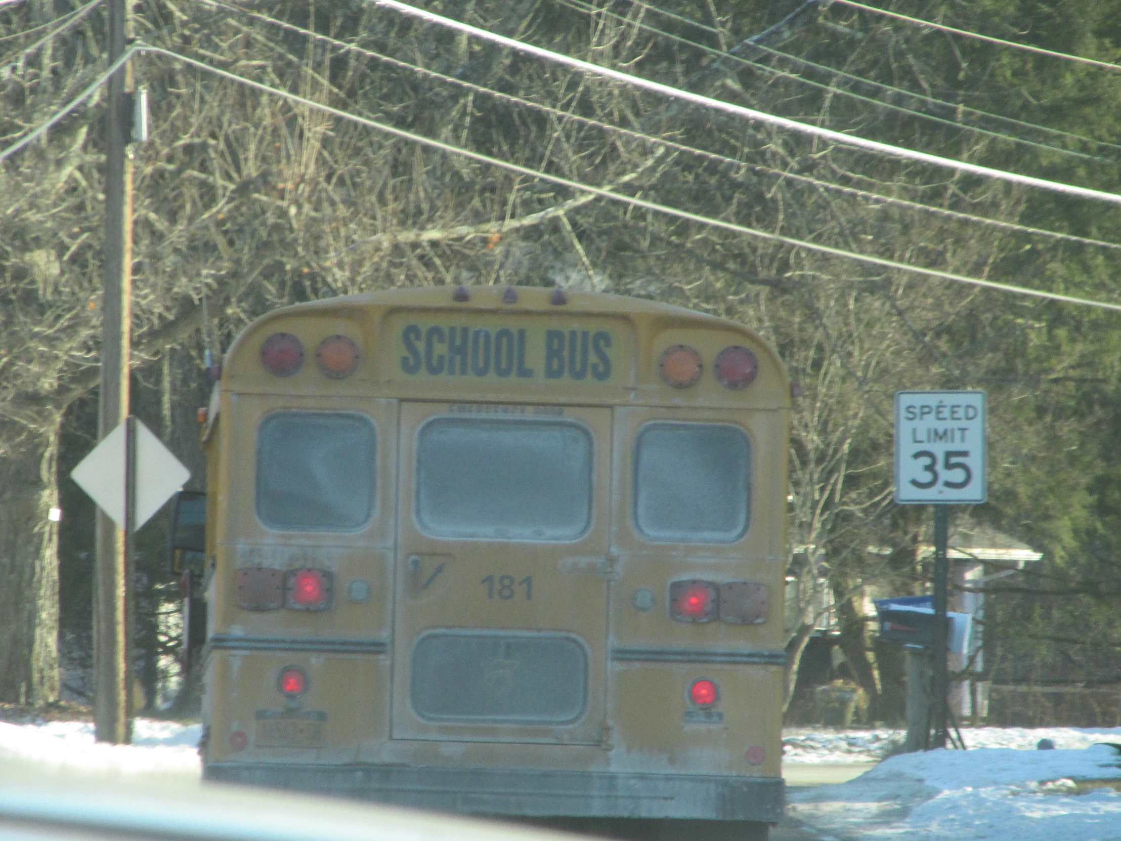 an empty school bus parked at a bus stop