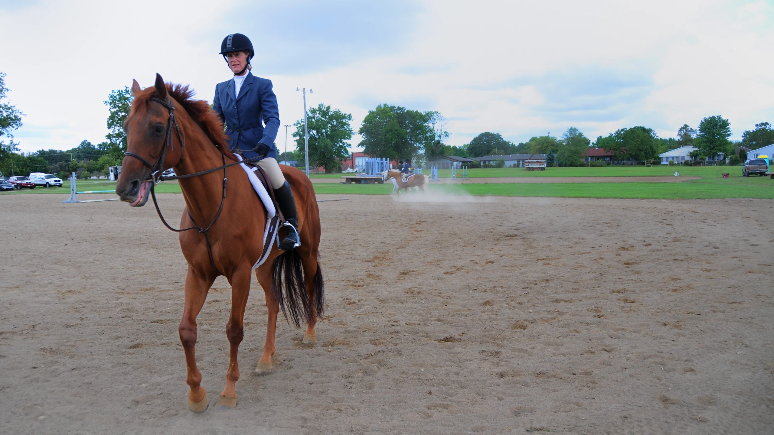 a man in a suit riding on the back of a horse