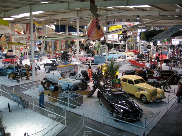 a display room with several cars on display