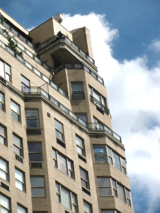 a tall building that has balconies on the top