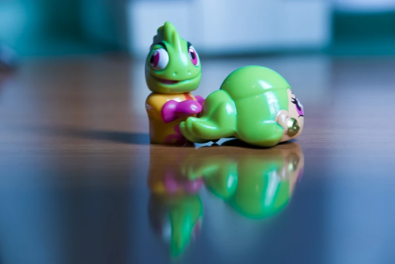 a close up view of a toy turtle on the ground