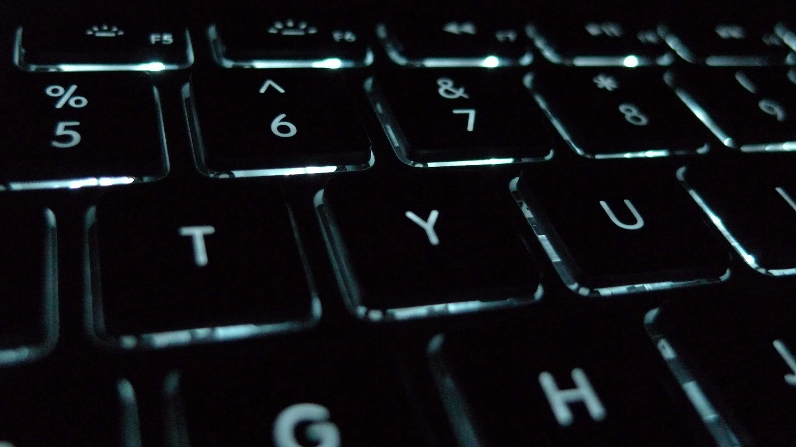 a close up of a keyboard in the dark